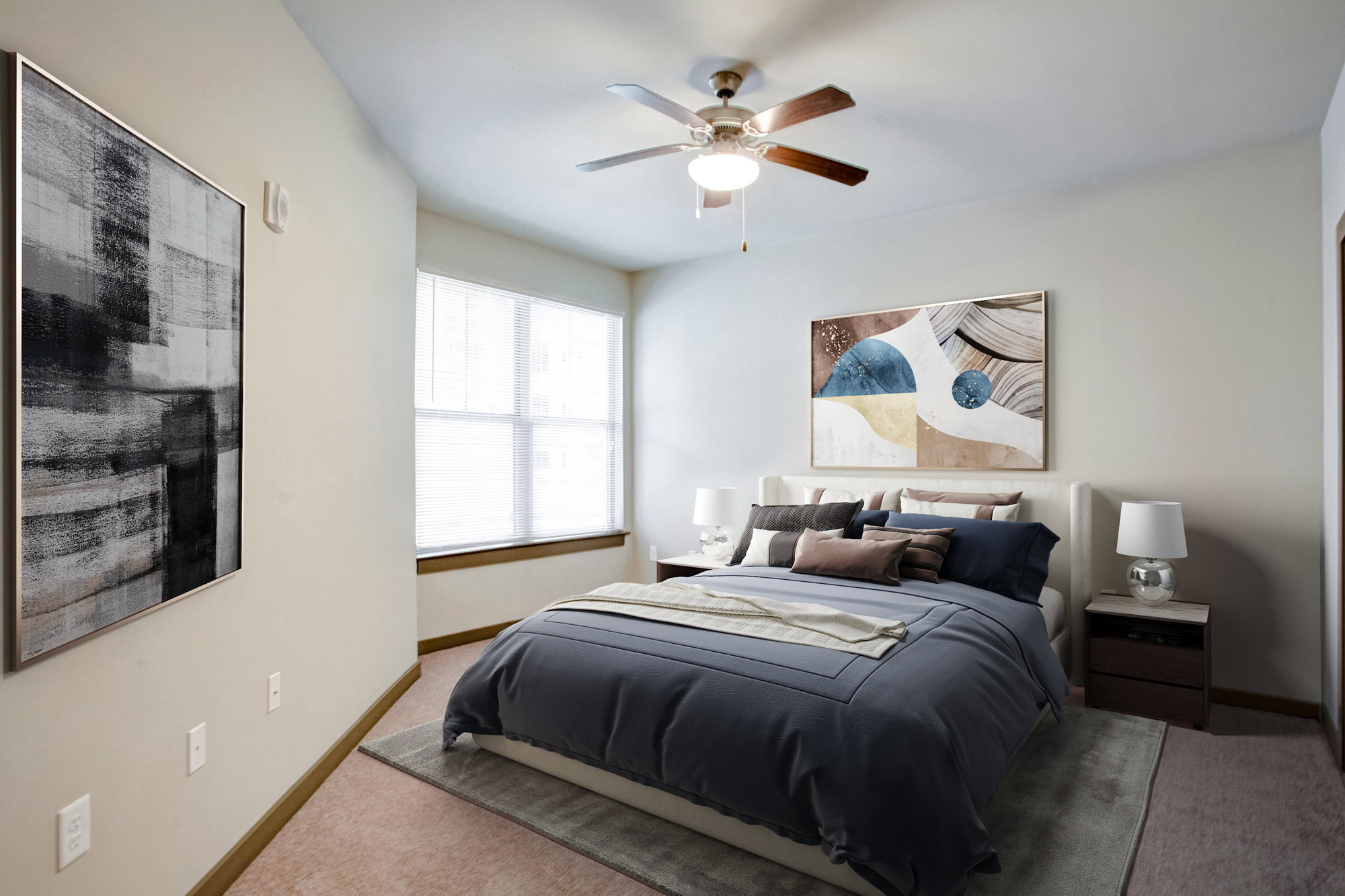 A blue duvet sits on top of a bed in Park 9 apartments near Atlanta, GA.