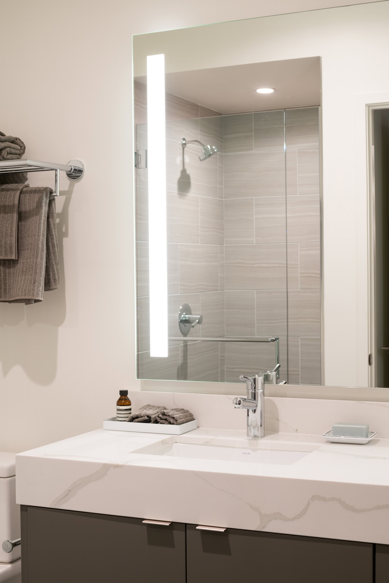 A spa-like bathroom sink and vanity in Ateliers luxury apartments in downtown LA