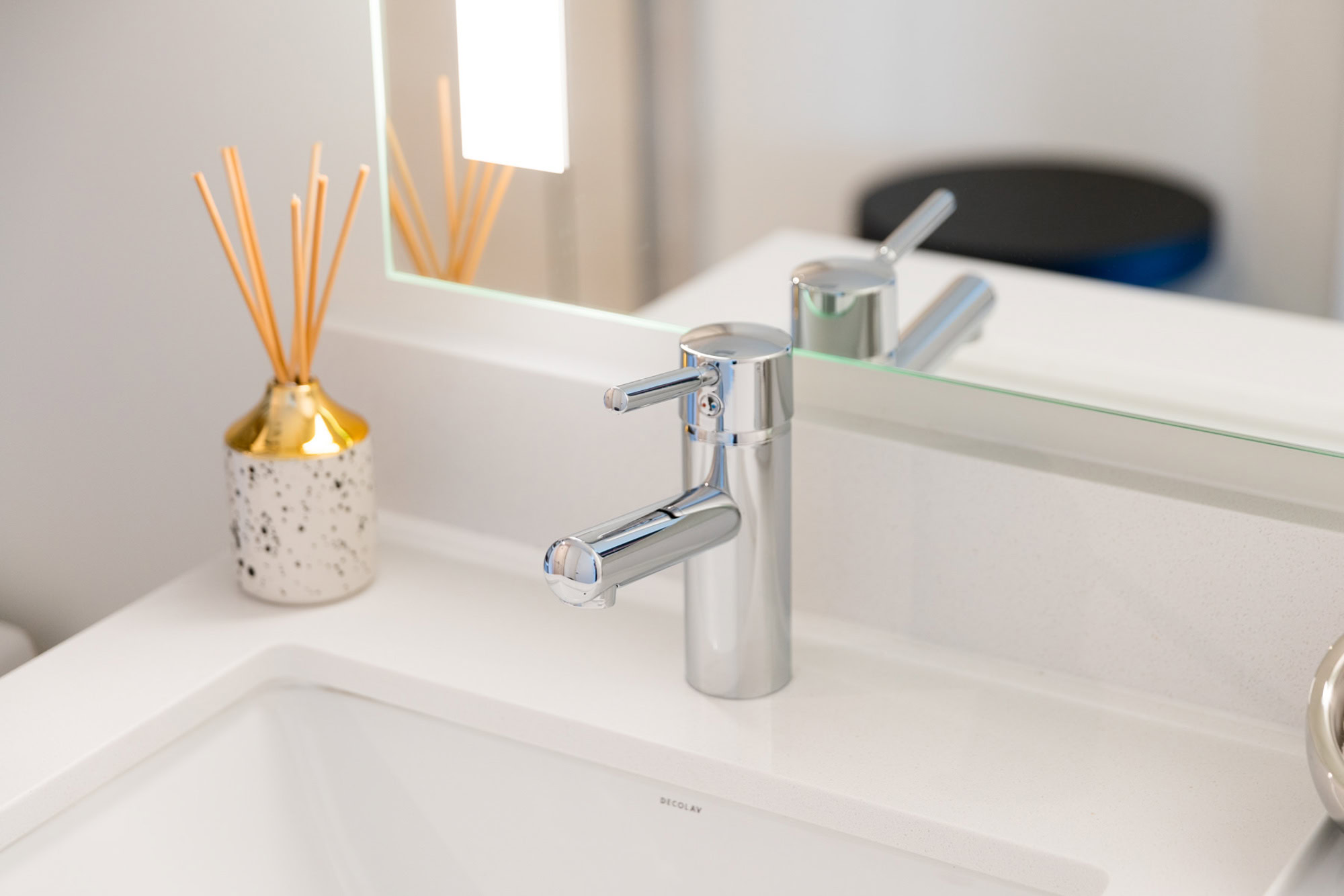 A close up shot of a bathroom sink and vanity at Ateliers luxury apartments in downtown LA