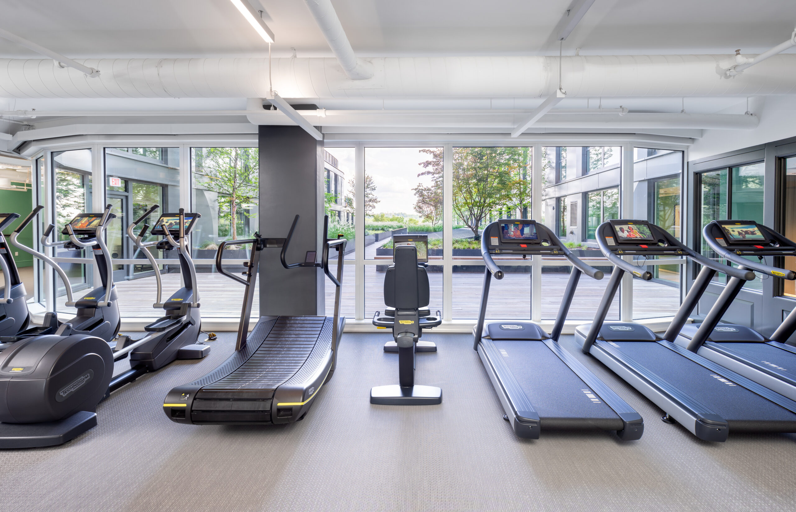 ellipticals and treadmills in apartment building fitness center