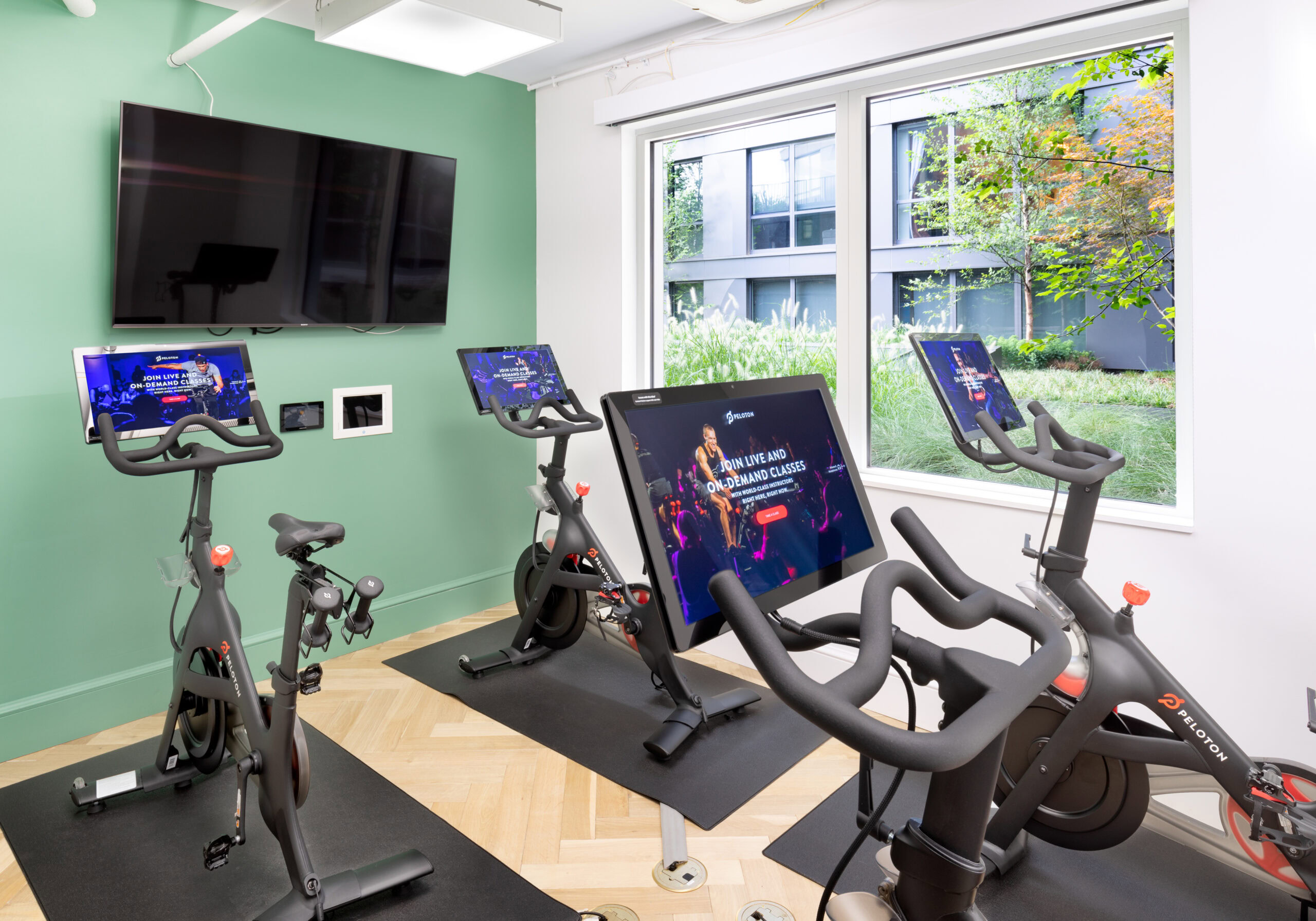 Peleton bikes in apartment building fitness center