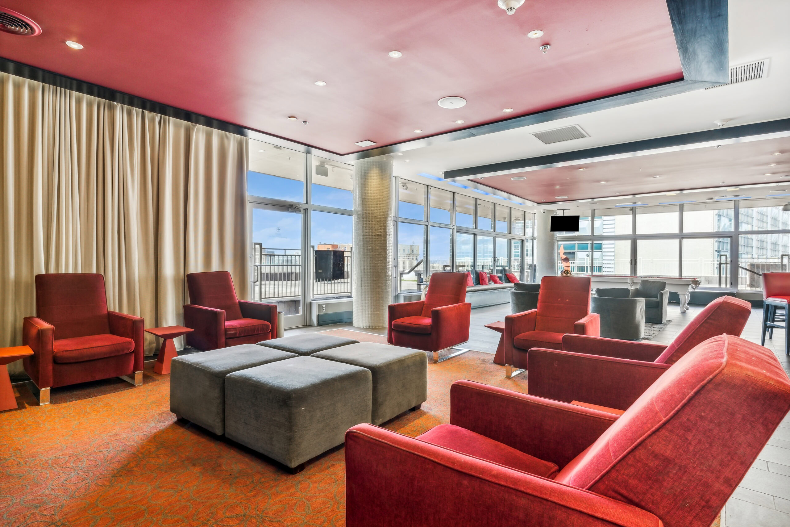 Cozy rooftop theatre in The Continentals rooftop lounge with curtains on the windows for privacy and lighting
