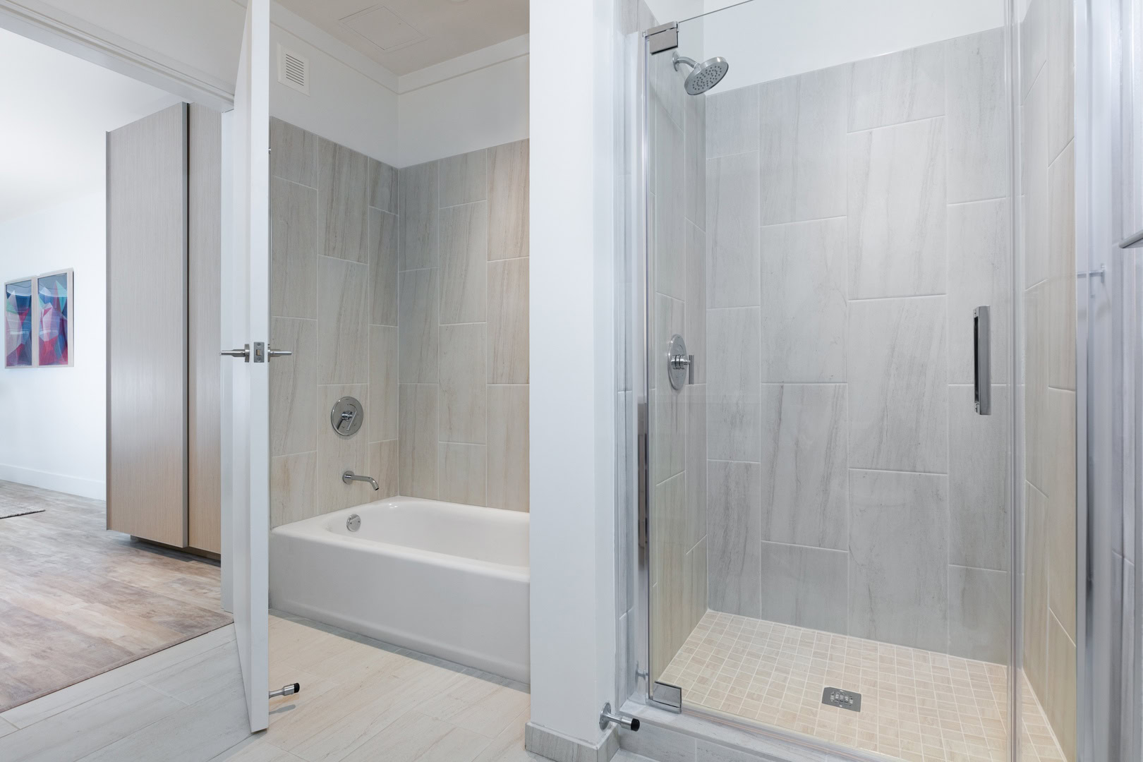 A spacious bathroom with a separate tub and shower at Temescal Oakland CA apartments, The Logan