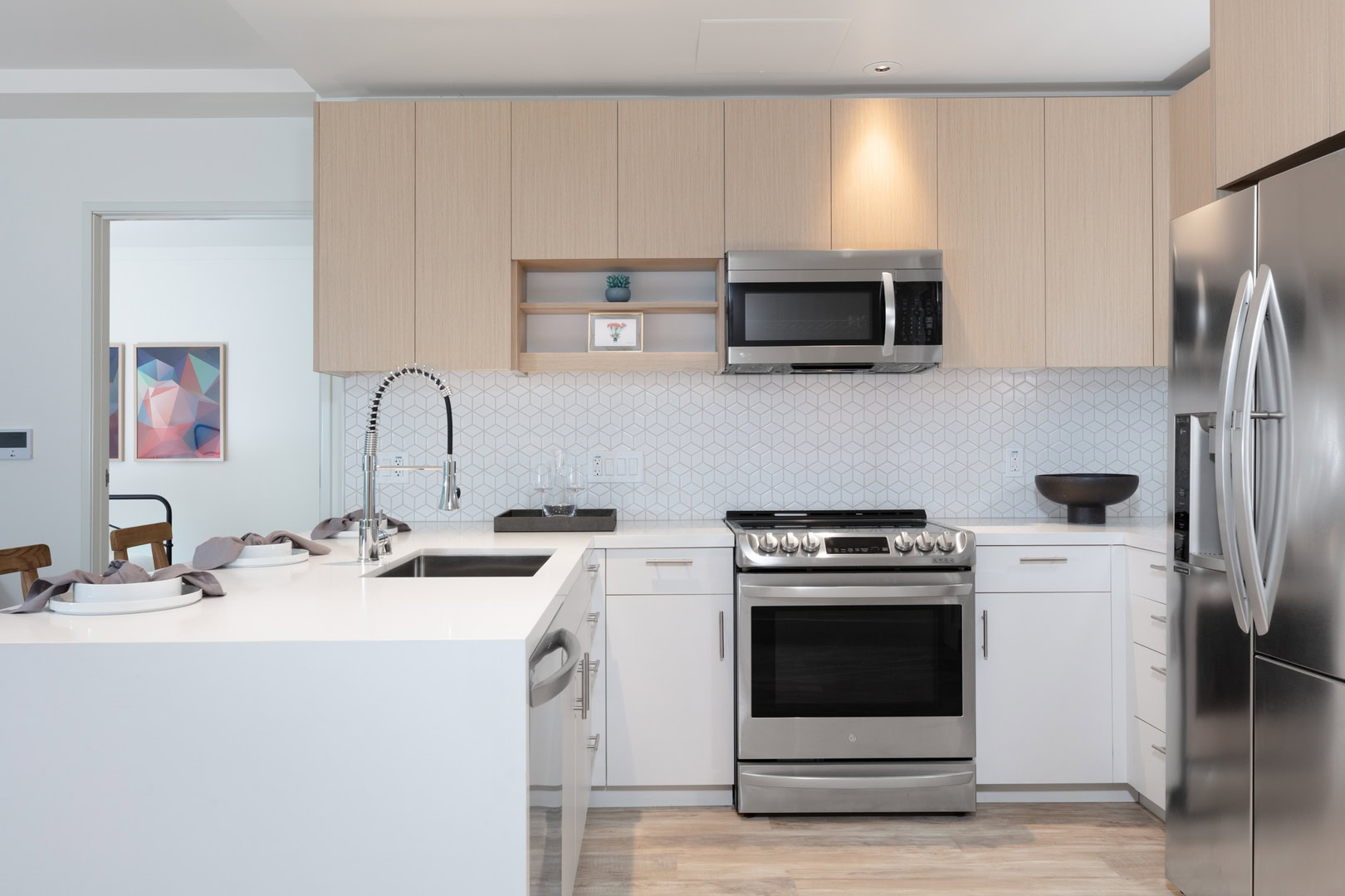 A modern kitchen with a peninsula at the Logan apartment rental in oakland