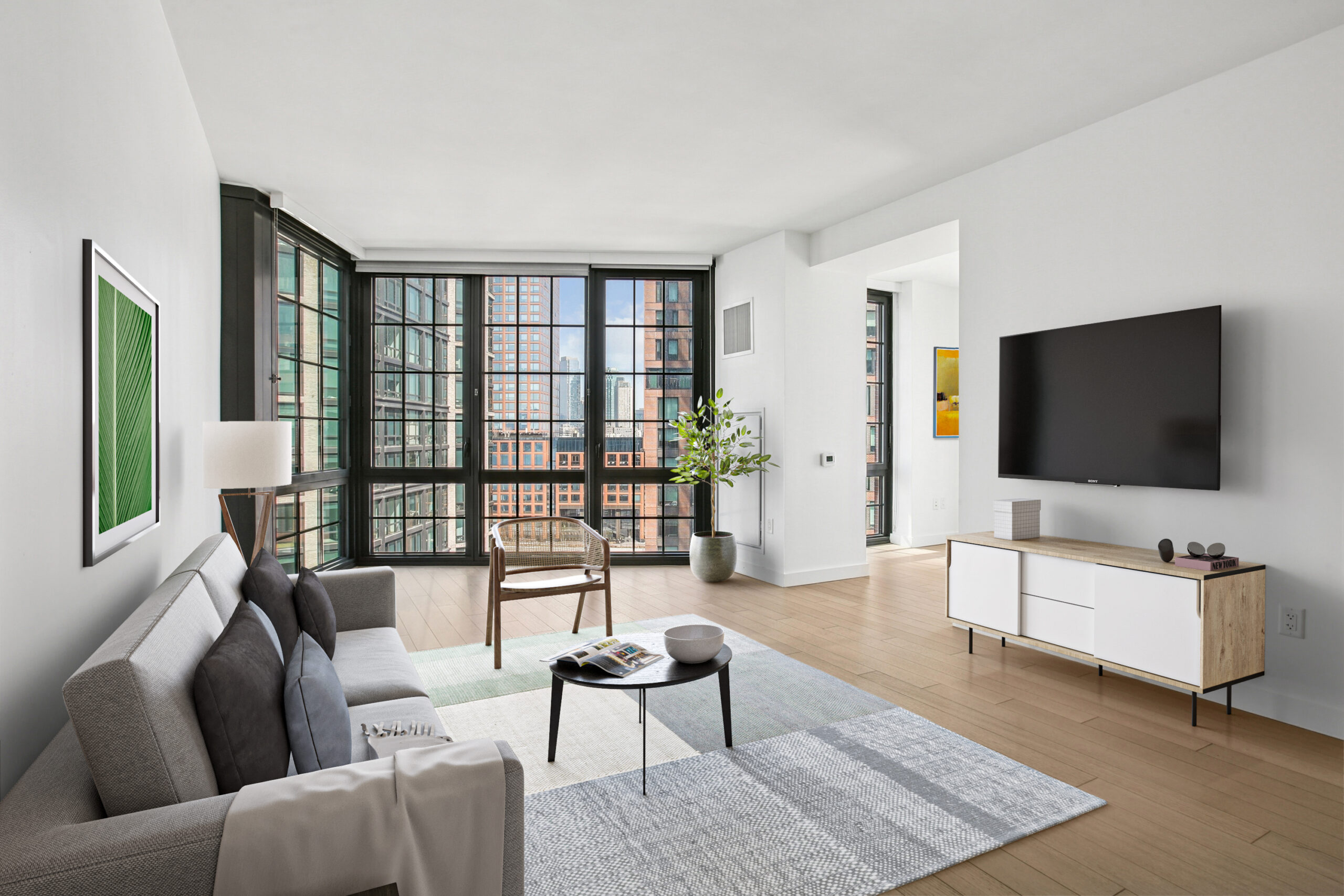 Modern living area with floor-to-ceiling windows offering city views